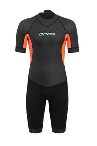 Men's ORCA Vitalis Shorty Wetsuit in black with striking orange hi-vis panels, featuring short sleeves and legs for swimming.