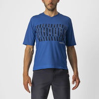 Stylish Castelli Trail Tech Tee in a relaxed fit, featuring a V-neck and vibrant sublimation-printed graphic for trail riding.