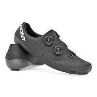 Stylish Bont Riot+ 24 Wide Fit cycling shoe in black and white, featuring a sleek carbon composite base and dual-dial BOA fit system for precision comfort.