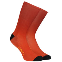 Vibrant Rust Core Socks showcasing a sleek design with mesh ventilation and a cycle-specific fit for ultimate comfort.