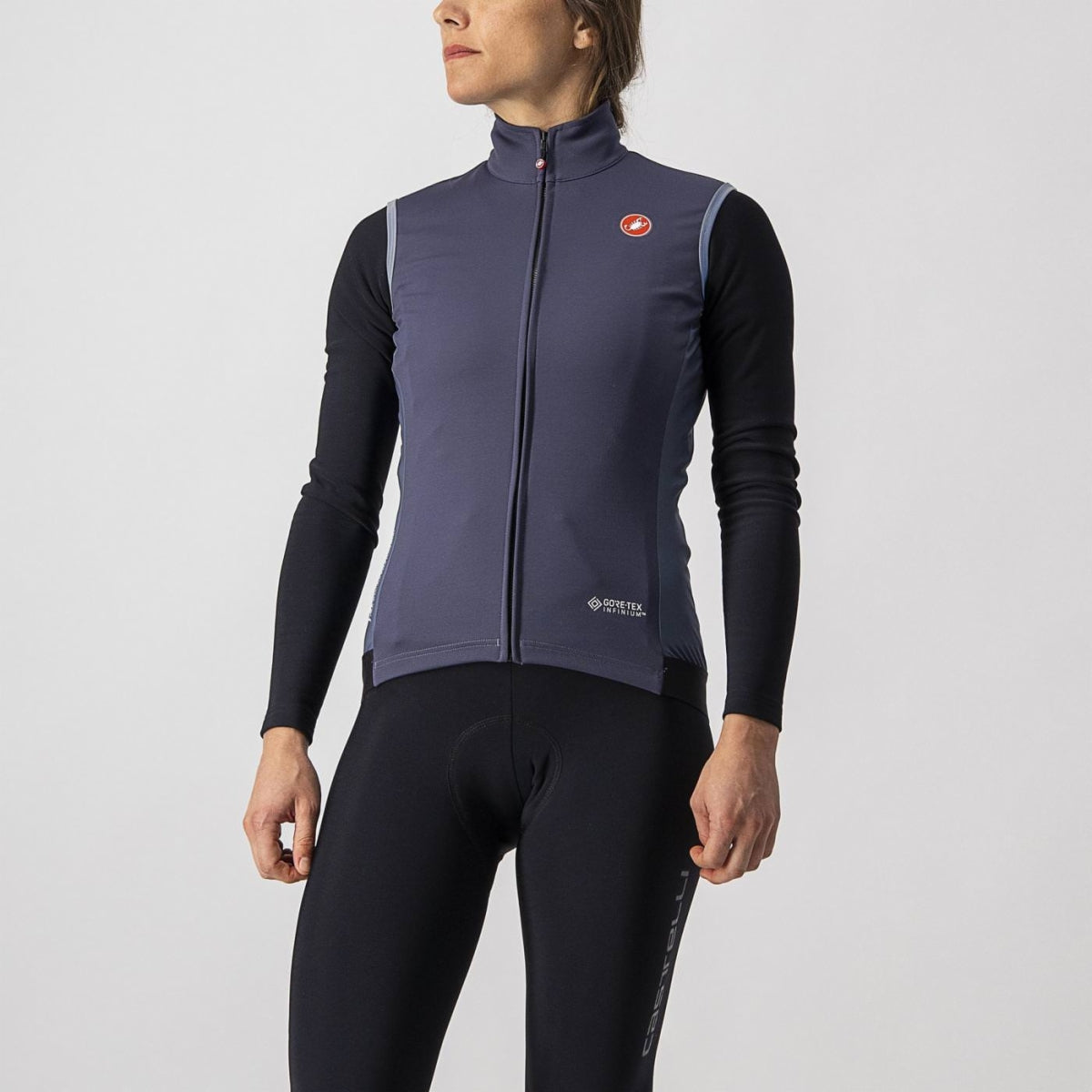 Sleek Castelli Perfetto RoS Vest in a dynamic pose, showcasing its windproof GORE-TEX front and breathable, water-repellent back.