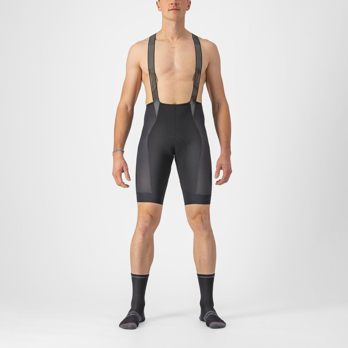 Lightweight Castelli Insider 2 Bibshorts in black, featuring airy mesh side panels and minimalist, breathable straps for indoor cycling comfort.