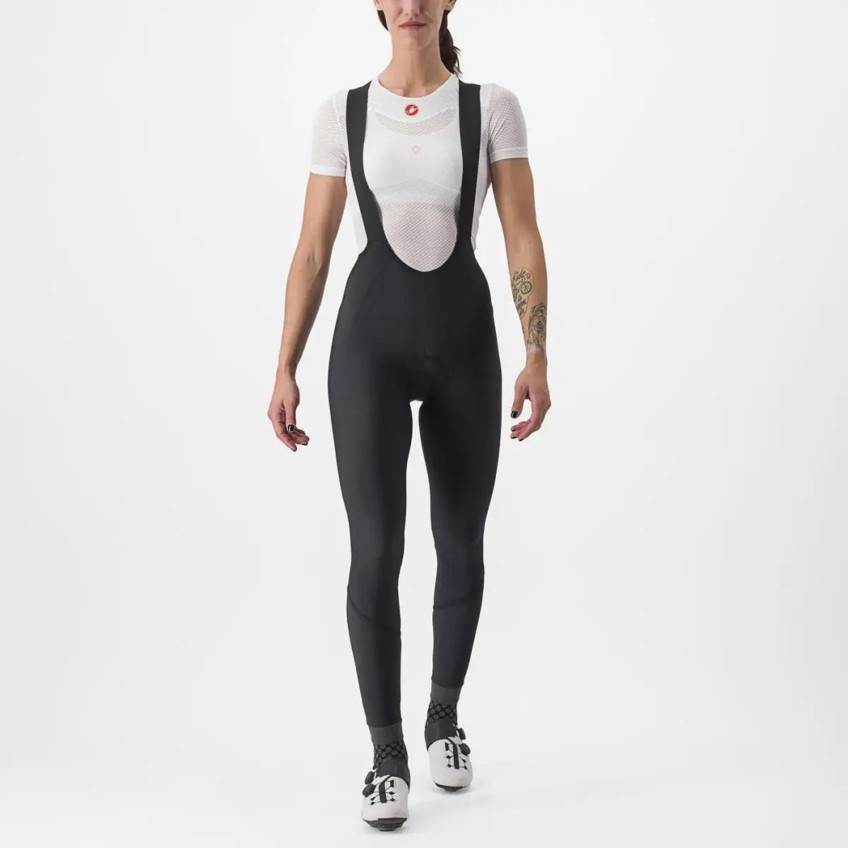Cozy women's Castelli Velocissima DT Bibtights in black, featuring reflective leg bands and ankle zippers for winter rides.