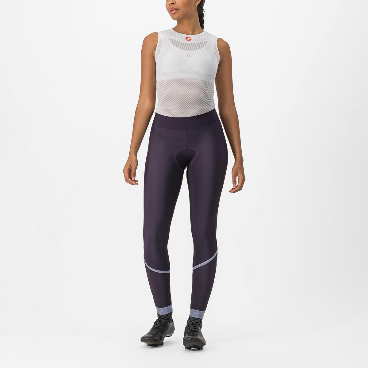 Cozy women’s Castelli Velocissima Thermal Tights in black, featuring a soft fleece lining, reflective leg band, and ankle zippers for warmth on cool winter rides.