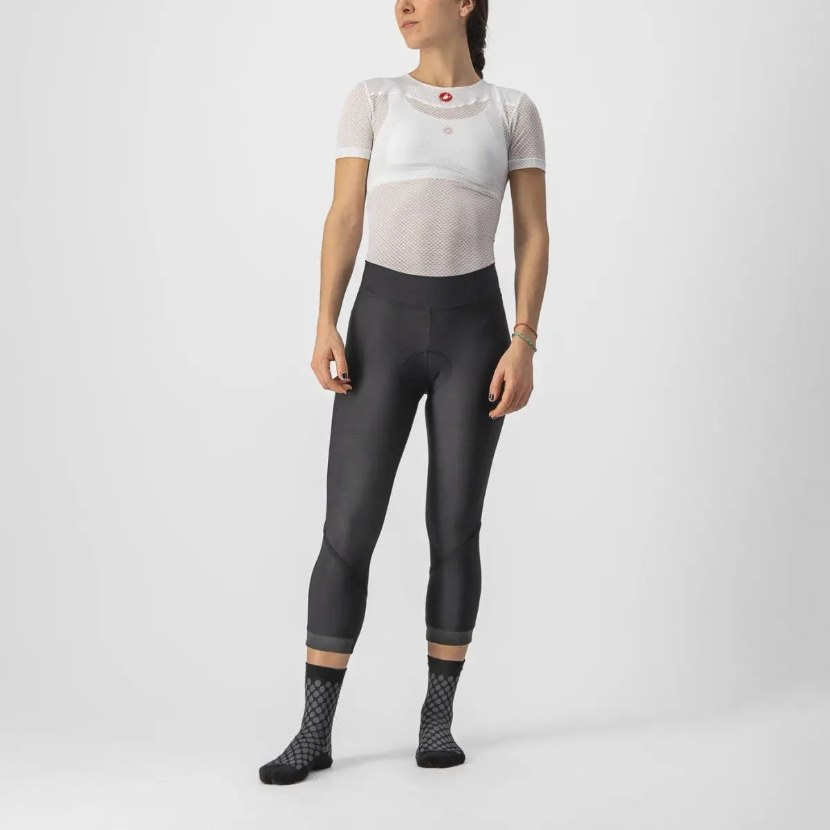 Cozy women’s Castelli Velocissima Thermal Knickers in black, featuring reflective leg bands and a soft, fleecy fabric for cool-weather cycling.