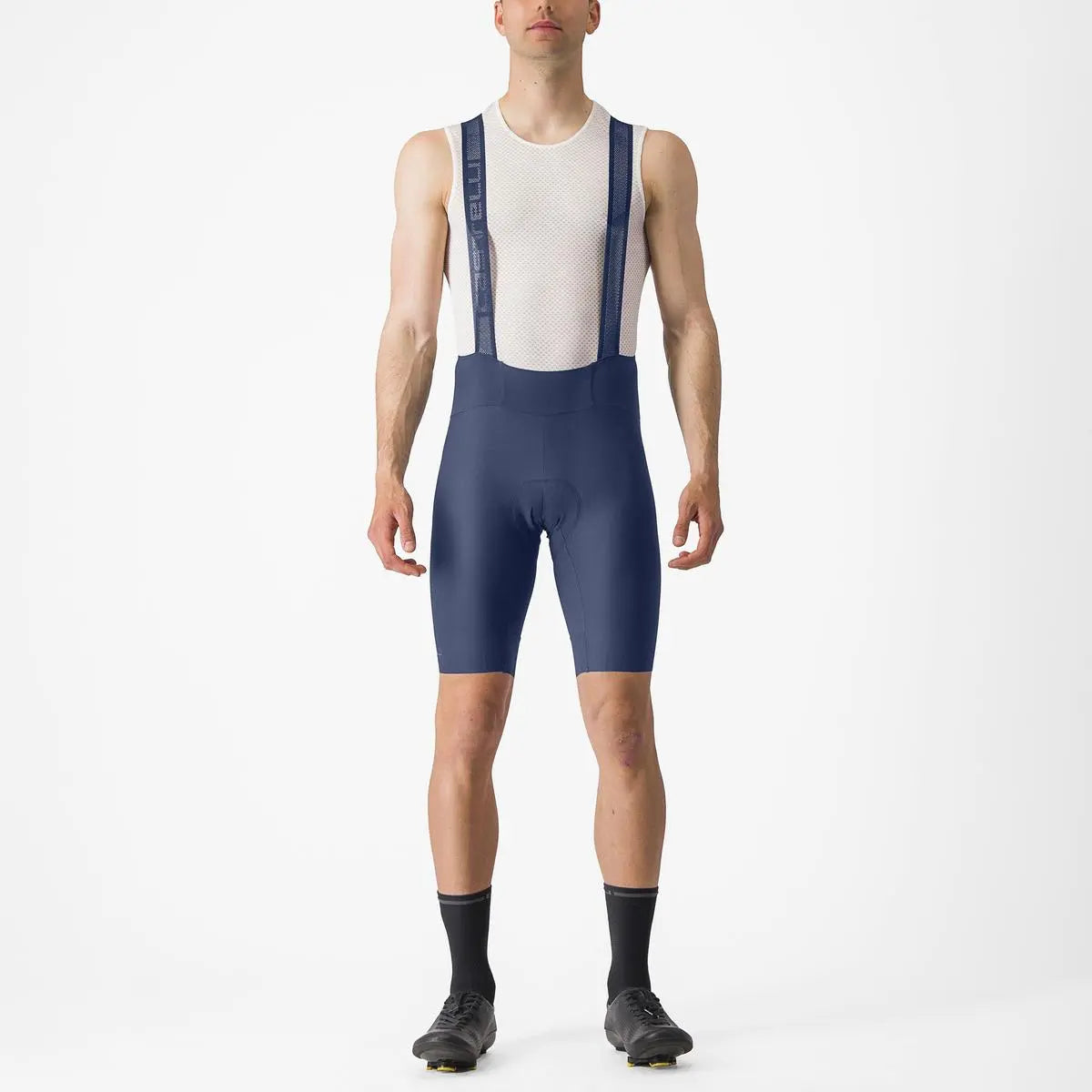 Stylish Castelli Espresso Bibshorts in black, featuring stretchy fabric, mesh straps, and reflective tabs for visibility.