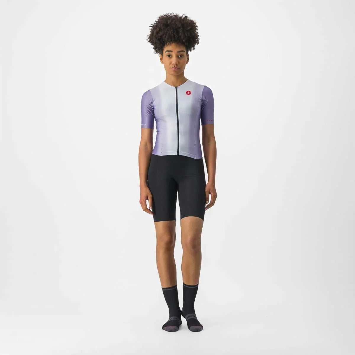 Sleek women's Castelli Sanremo Ultra Speed Suit in a dynamic pose, showcasing its aerodynamic design and vibrant color.