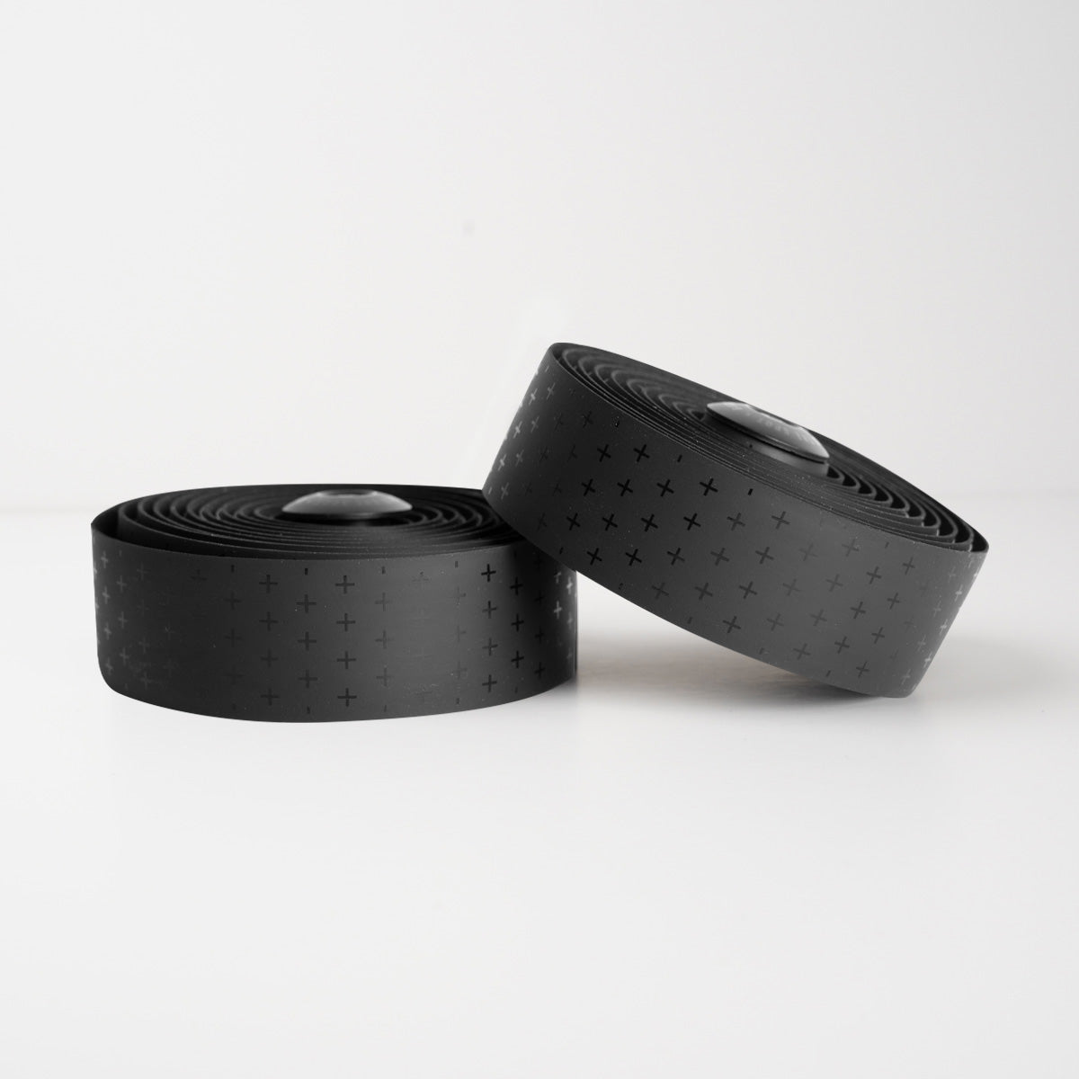 Sleek black BURGH Bar Tape Addition Stealth with bold, repeating addition symbols for a striking, structured look.