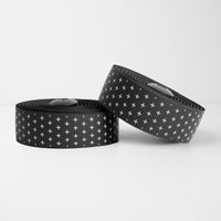 White BURGH Bar Tape with bold black addition symbols, offering a structured, stylish look and superior grip for cyclists.