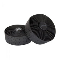 Sleek black BURGH Bar Tape Bokeh Stealth with glossy black print, designed for cyclists and photographers, on a bike handlebar.