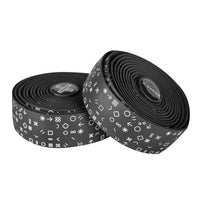 White Burgh Hieroglyph Bar Tape with subtle Egyptian-inspired grid patterns and glossy accents on a black base for bike handlebars.