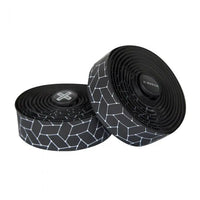 Smooth white Burgh Bar Tape with a glossy finish, mimicking the luxurious feel of silk on a sleek black base for bike handles.