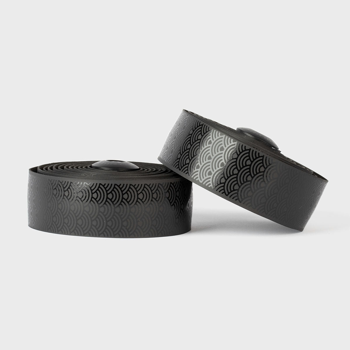 Sleek black Burgh Wave Bar Tape with a glossy Japanese seigaiha wave pattern, symbolizing power and resilience for cycling.