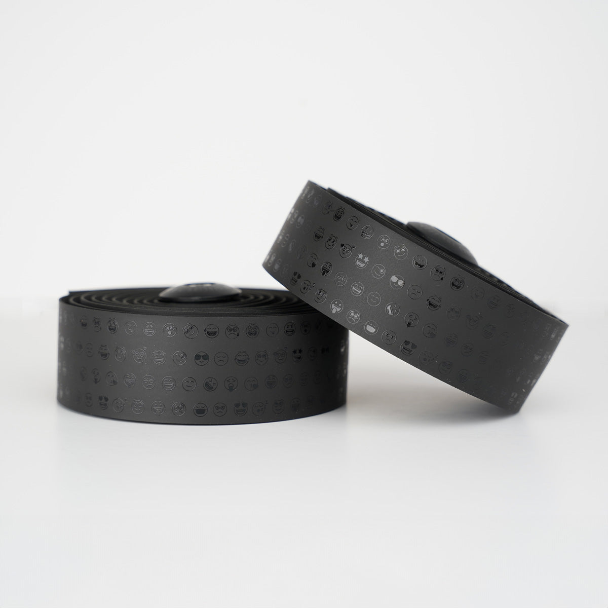 Vibrant black BURGH Bar Tape with playful emoji designs, featuring a grippy, all-weather surface for stylish cycling.