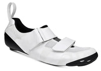 Sleek Bont Riot TR+ triathlon shoe in black and white, showcasing a carbon composite design with Velcro straps for quick transitions.